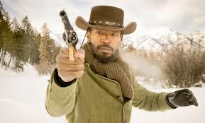 Jamie Foxx as Django, levelling a revolver in the snow