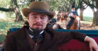 Leonardo DiCaprio as Calvin Candie, smiling from a carriage
