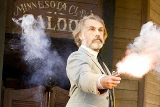 Christoph Waltz as Dr. King Schultz firing outside the Minnesota Clay saloon