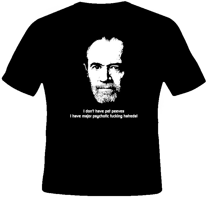 A black T-shirt printed with George Carlin’s face and the line “I don’t have pet peeves, I have major psychotic fucking hatreds!”