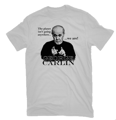 A T-shirt printed with Carlin pointing at the viewer and the line “The planet isn’t going anywhere… we are!”