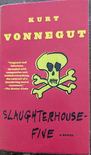 A worn paperback of Slaughterhouse-Five by Kurt Vonnegut